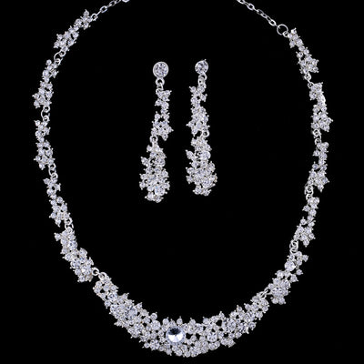 Silver-toned rhinestone necklace and matching dangle earrings set, featuring a sparkling floral cluster design. - Image 6