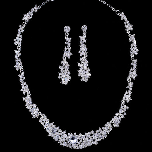 Silver-toned rhinestone necklace and matching dangle earrings set, featuring a sparkling floral cluster design. - Image 6