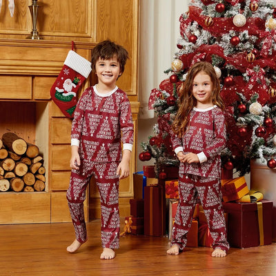 Family of four in matching Christmas pajamas: white tops with red tree graphic, red bottoms with white text. - Image 8