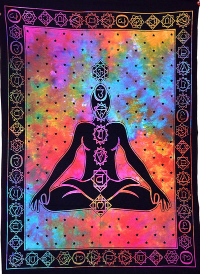 Colorful tie-dye tapestry with a meditating figure outlined in black, featuring chakra symbols along the body and a symbolic border.