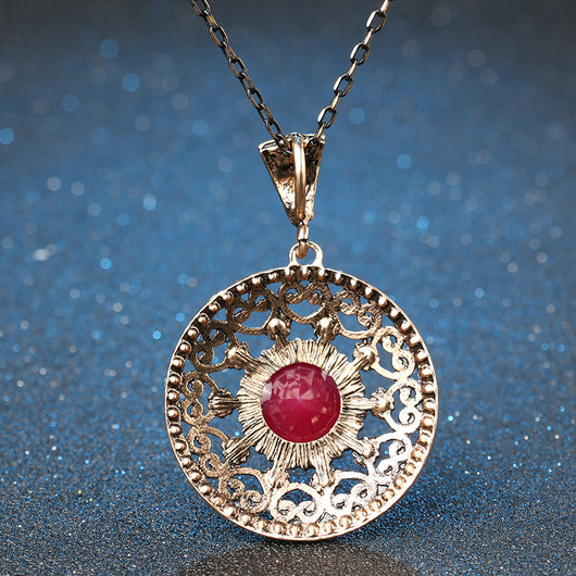 Vintage-style jewelry set with a necklace and matching drop earrings. Features red and clear gemstones in an antique gold-tone filigree design. - Image 3