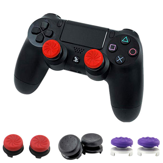 Two black ABS thumb grip extenders for PlayStation 4 controllers, featuring a textured surface for enhanced grip.