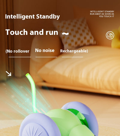 Green and purple electric mouse car cat toy with a glowing tail on a woven mat, designed for interactive play. - Image 9