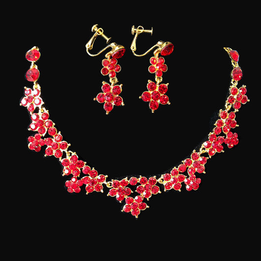 Sparkling crystal bridal jewelry set with floral necklace, drop earrings, and a matching tiara on a bride. - Image 8