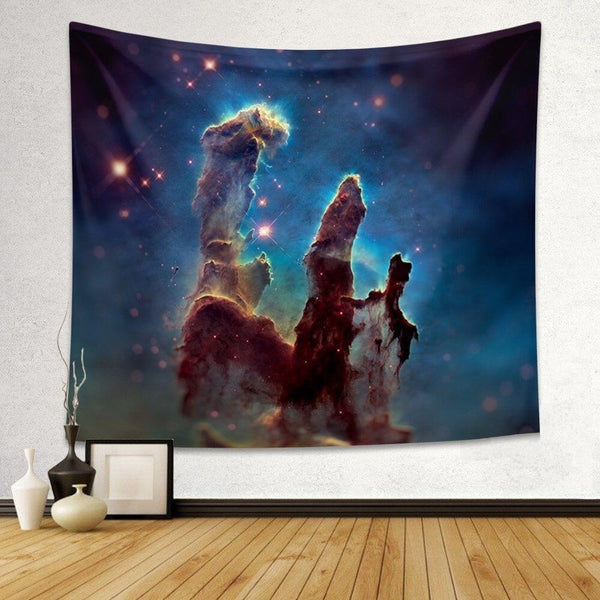 Pillars of Creation nebula tapestry featuring towering cosmic dust and gas formations in blue, gold, and red.