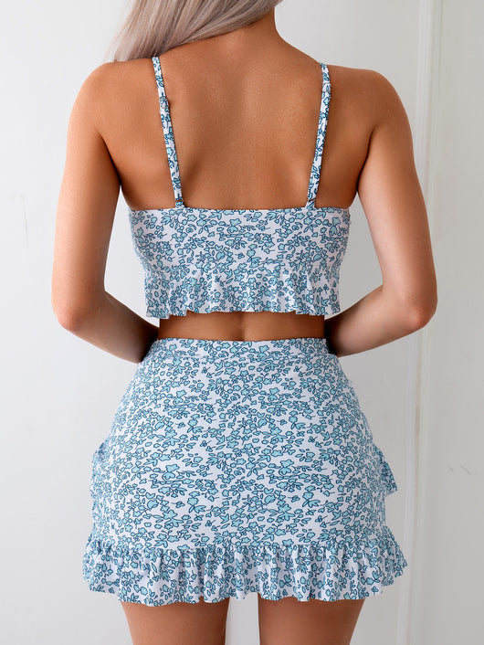 Women's blue and white floral print two-piece set with ruffled crop top and matching mini skirt. - Image 11