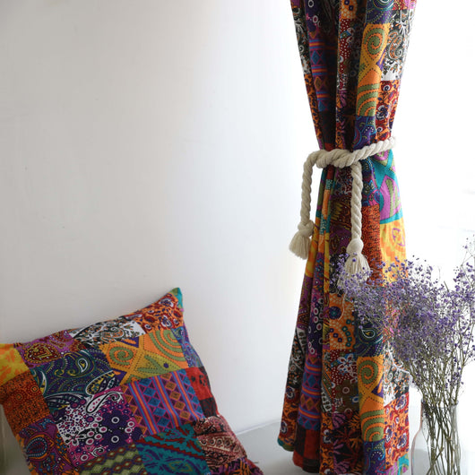 Bohemian retro style cotton linen curtains with a vibrant geometric patchwork pattern, one tied back with a rope. - Image 4