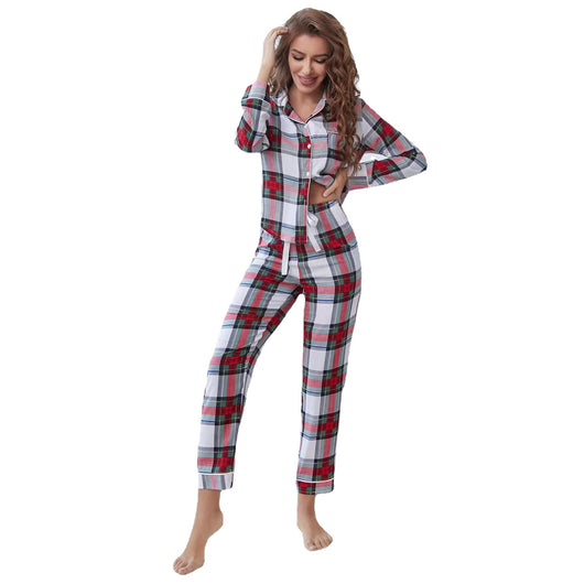 Woman wearing a red, white, and green plaid two-piece pajama set with a button-up top and long pants. - Image 5