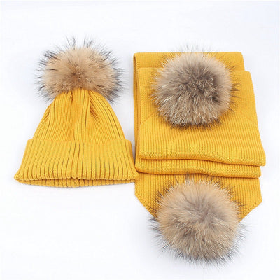 Red knitted hat and scarf set with fluffy brown and black fur pom-poms, ideal for warm winter wear. - Image 3