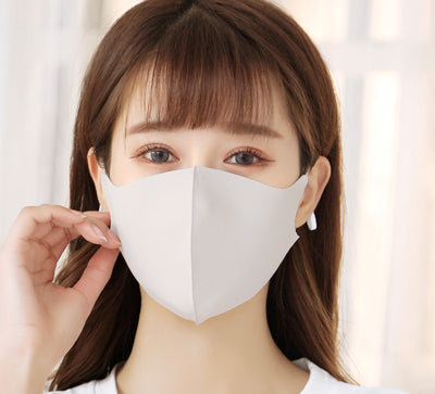 Woman wearing a light gray ice silk face mask with ear loops, suitable for summer and spring. - Image 8