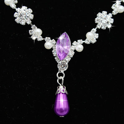 Purple rhinestone and faux pearl necklace and drop earrings set on a black display. Features silver-tone settings. - Image 2