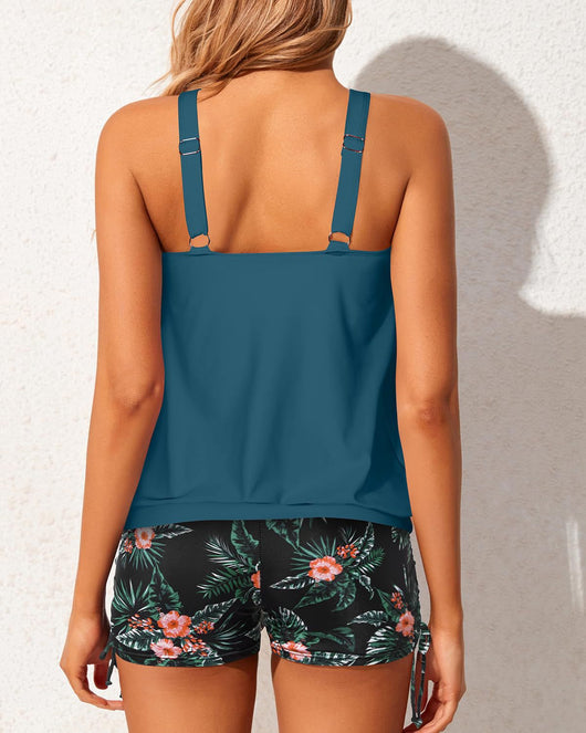 Women's two-piece tankini swimsuit with a colorful abstract print tank top and solid black ruched swim shorts. - Image 26