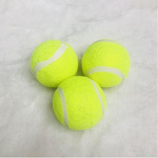 Three bright yellow dog tennis balls with white seams, made of rubber and felt, stacked on a soft background. - Image 2