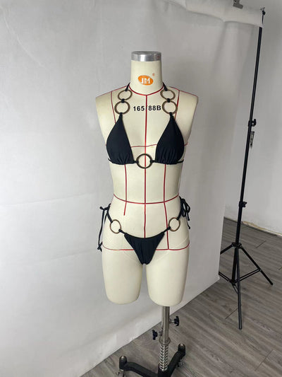 Black two-piece bikini with gold-tone O-ring details. Triangle top and tie-side bottoms for women. - Image 14