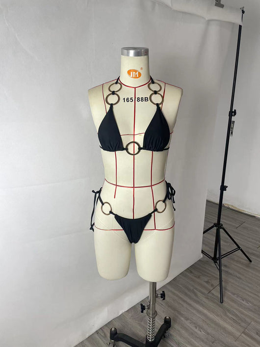 Black two-piece bikini with gold-tone O-ring details. Triangle top and tie-side bottoms for women. - Image 14