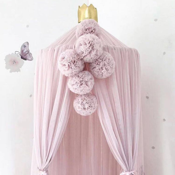 Pink, white, and purple yarn ball pendant party decoration with a fabric tie, ideal for children's rooms.