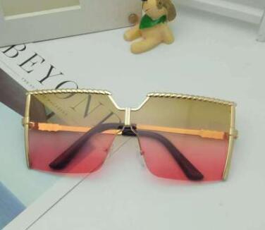 Frameless conjoined sunglasses with gold metal frame and braided detail, featuring brown gradient lenses. - Image 14