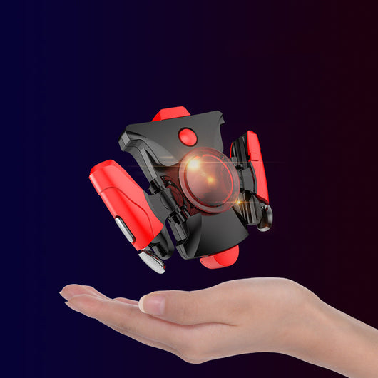 Black and red mobile phone gamepad with mechanical buttons floating above an open hand. - Image 12