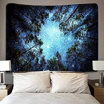 Printed tapestry featuring a vibrant blue starry night sky seen through a dark forest tree canopy.
