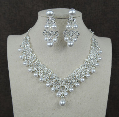 Silver-tone necklace and matching chandelier earrings set with clear rhinestones and white faux pearls. - Image 2