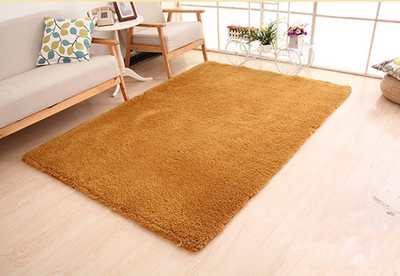 Fluffy purple rectangular area rug on a light wood floor in a modern living room with a sofa and plant stand. - Image 6