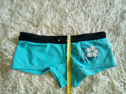 Black halter bikini suit with boy short bottoms, featuring pink and blue floral and flamingo patterns. - Image 14