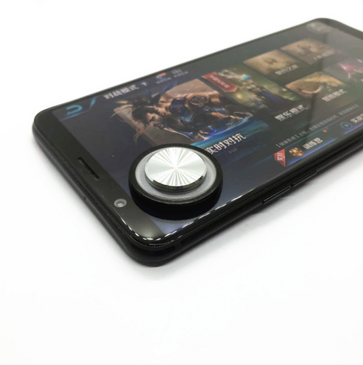 Pink and silver mobile game joystick attached to a black smartphone displaying a game on its screen. - Image 9