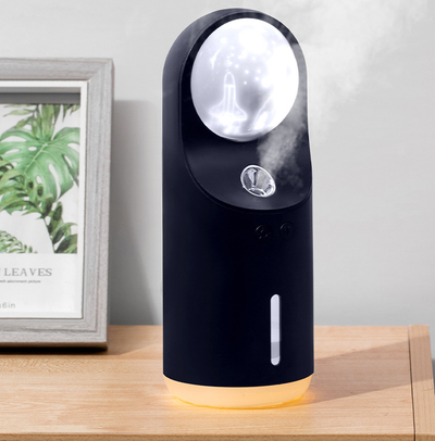 White and dark gray mini wireless ultrasonic humidifier and essential oil diffuser with an illuminated LED night lamp. - Image 6