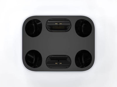 White and black dual charging dock for PS5 gamepads, featuring two charging ports and two storage slots. - Image 4