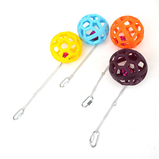 Orange hollow rubber ball bird toy with a pink bell inside, hanging from a silver chain and carabiner clip. - Image 5