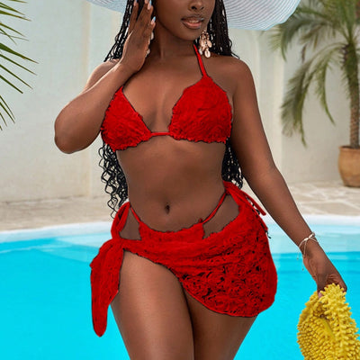 Red three-piece bikini set with a halter top, tie-side thong bottom, and sarong, all featuring a raised floral pattern. - Image 33
