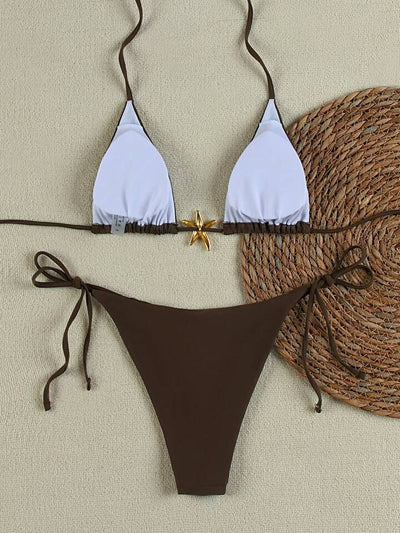 White women's bikini with triangle top and tie-side bottom, featuring a gold starfish charm on the center front. - Image 39