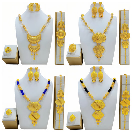 High-end gold-tone bridal wedding jewelry set with necklace, crescent earrings, ring, and bracelet, featuring intricate patterns and clear beads.