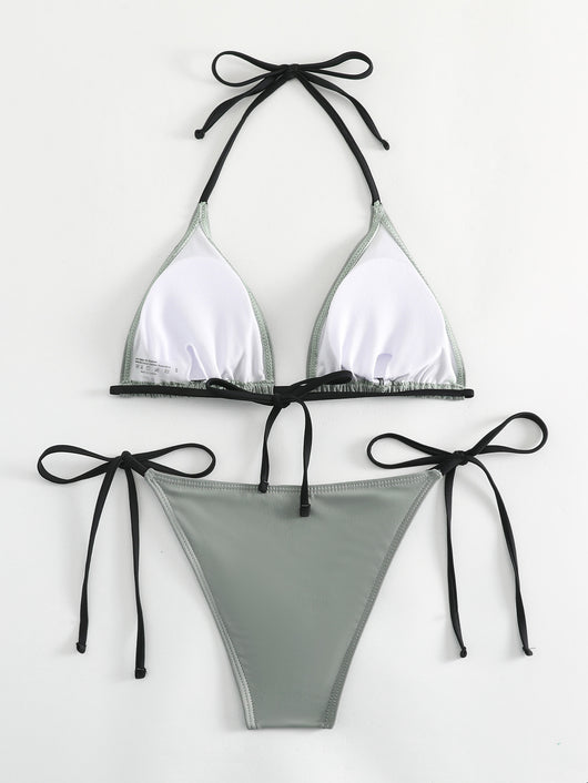 Neon yellow halter bikini with triangle top and tie-side bottoms, displayed on a light wood surface. - Image 38