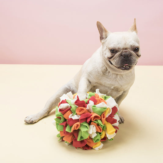 Red, yellow, and orange polar fleece snuffle ball pet toy for chewing and enrichment.