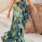 Vestido Verde Asimétrico con Abertura y Detalle de Hombro Descubierto