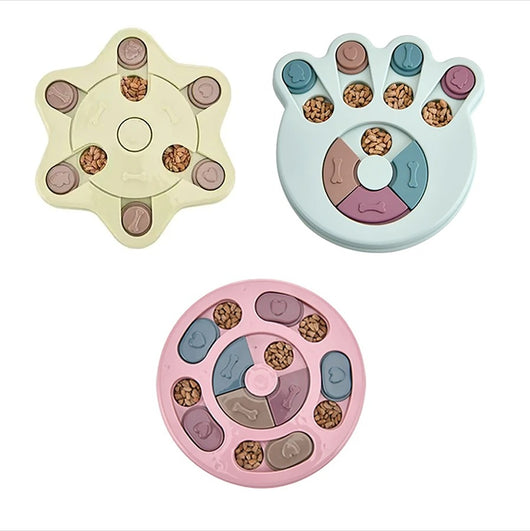 Paw-shaped dog puzzle feeder toy in light yellow with colorful sliding covers, filled with kibble. - Image 7