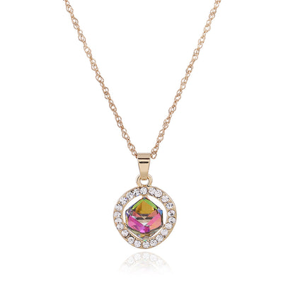 Gold-colored necklace and stud earrings set with iridescent multi-faceted crystal pendants surrounded by clear crystals. - Image 3