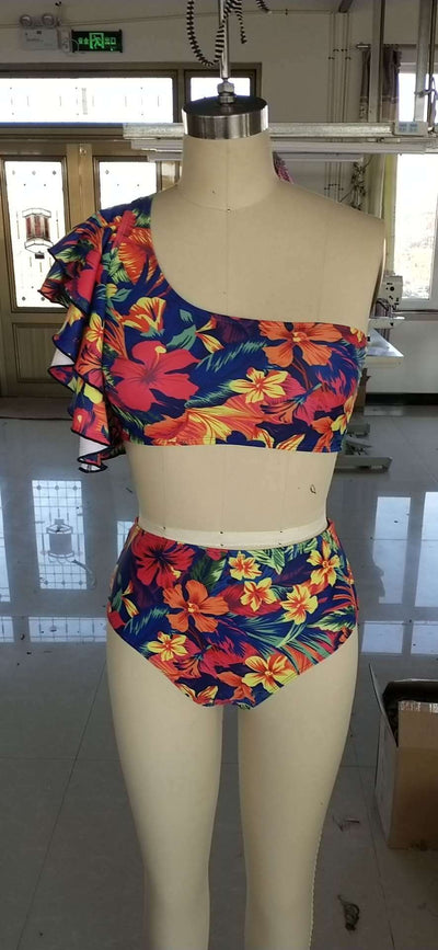 Vibrant one-shoulder ruffle print swimsuit with a lace-up top and high-waisted ruched bottoms, featuring a tropical floral pattern. - Image 4