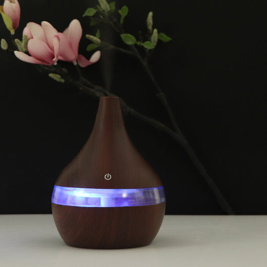 Dark wood grain USB mini tip air purifier and humidifier with a teardrop shape and a silver band. - Image 5