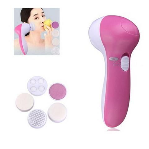 White electric facial cleanser with multiple brush and sponge attachments in an open translucent teal carrying case. - Image 2
