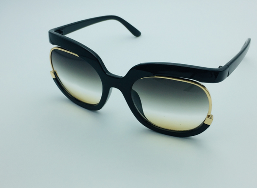 Black cat-eye half-frame sunglasses with gold accents and purple-grey gradient lenses, shown from front and side. - Image 2