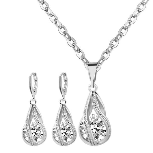 Silver teardrop necklace and matching drop earrings set with clear zircon gemstones, ideal for a bride or wedding. - Image 6