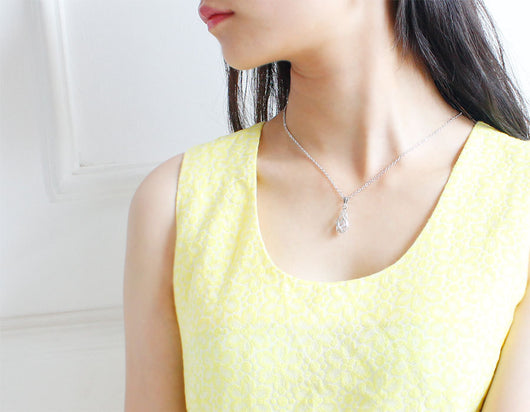 Silver teardrop necklace and matching drop earrings set with clear zircon gemstones, ideal for a bride or wedding. - Image 4