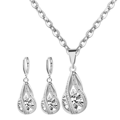 Silver teardrop necklace and matching drop earrings set with clear zircon gemstones, ideal for a bride or wedding. - Image 7