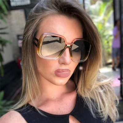Large frame sunglasses with gradient purple lenses and a blue-to-clear fade on the bottom of the frame.