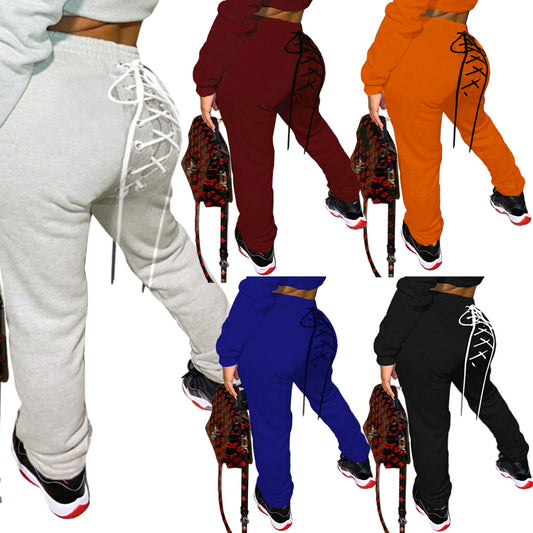 Conjunto de Buzo y Pantalón Deportivo con Ojetes de Color Sólido