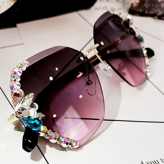 Oversized rimless sunglasses with gradient gray lenses and colorful rhinestone embellishments along the top and sides. - Image 5
