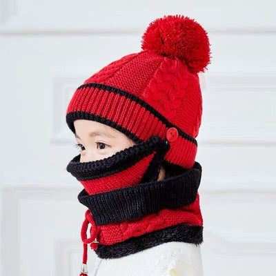 Young child wearing a pink and grey knitted hat with a pom-pom and a matching neck warmer with a drawstring. - Image 5