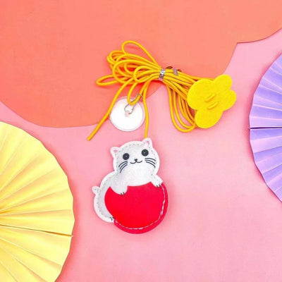 Colorful cat toy with pom-poms, googly eyes, white feathers, and a yellow elastic rope with a suction cup. - Image 10